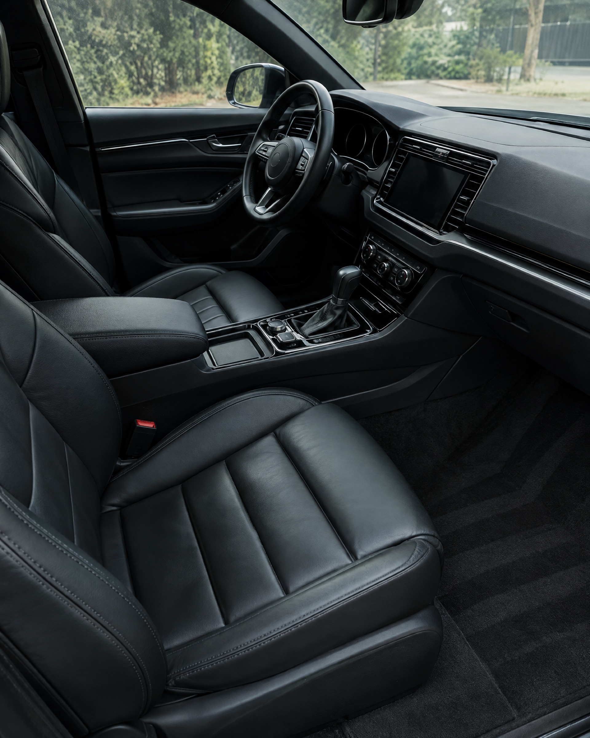 Spotless detailed car interior with clean black leather seats in Columbia, MO